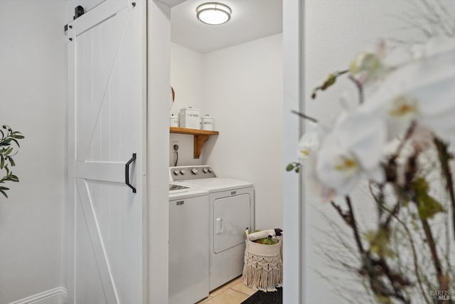 washroom featuring light tile patterned floors and separate washer and dryer