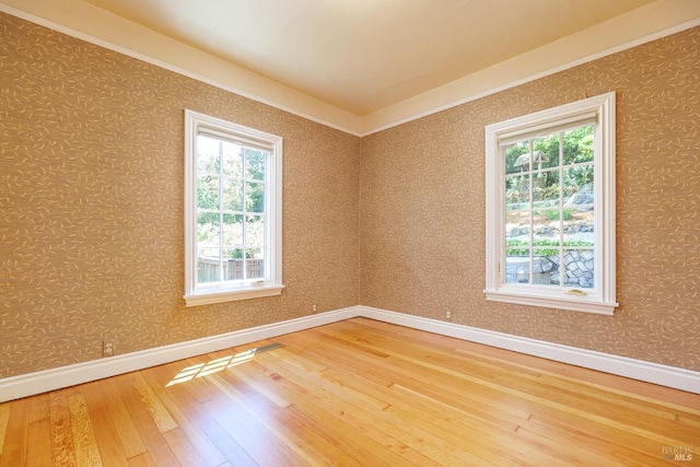 unfurnished room featuring hardwood / wood-style floors