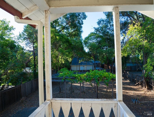 view of patio with a garden and a fenced backyard