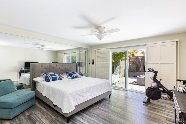 bedroom with multiple windows, access to exterior, dark wood-type flooring, and ceiling fan