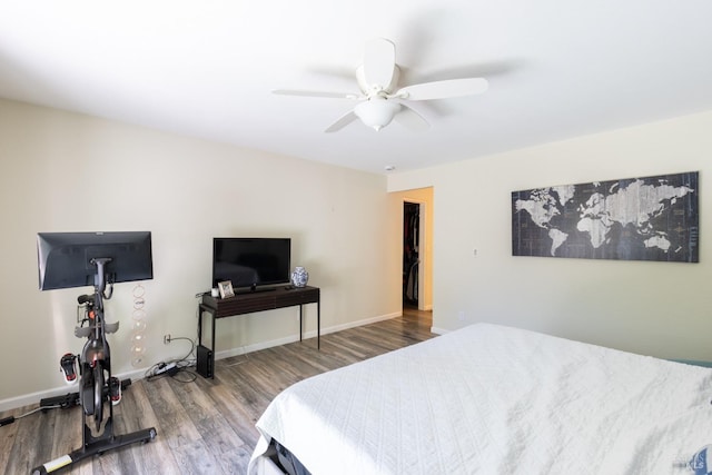 bedroom featuring hardwood / wood-style flooring and ceiling fan