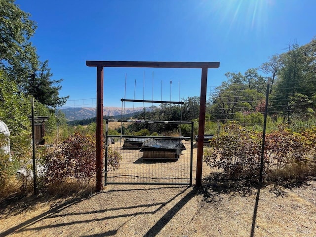 view of gate with fence