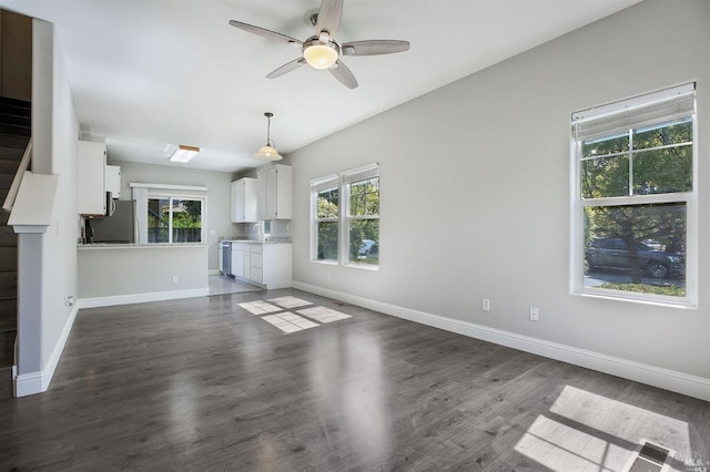 unfurnished living room with ceiling fan and dark hardwood / wood-style flooring