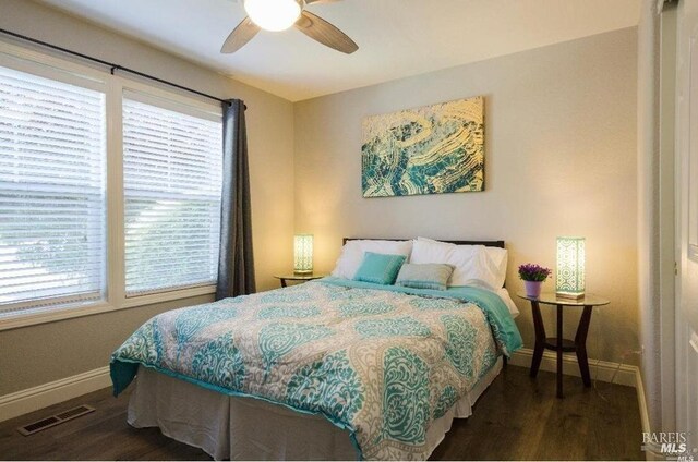 bedroom featuring dark wood-type flooring and ceiling fan