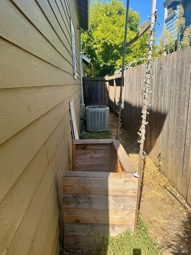 view of side of property featuring central AC unit