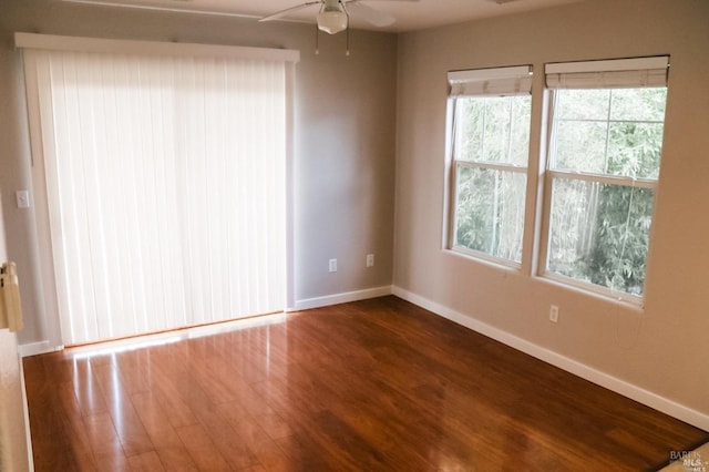 empty room featuring ceiling fan and wood-type flooring