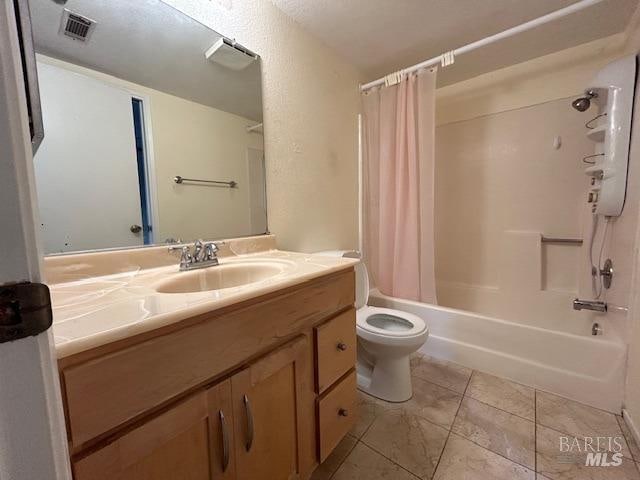 full bathroom with vanity, toilet, and shower / bathtub combination with curtain