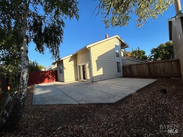 rear view of property featuring a patio