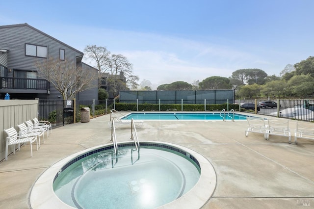 view of pool featuring a hot tub