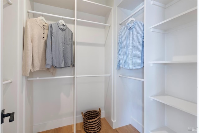 walk in closet featuring hardwood / wood-style flooring