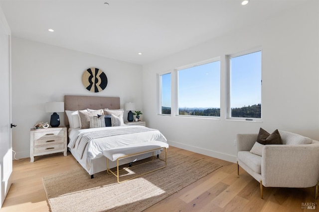 bedroom with light wood-type flooring