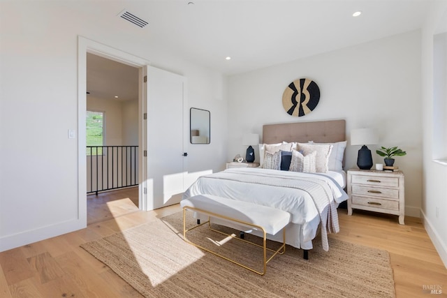 bedroom with light hardwood / wood-style floors