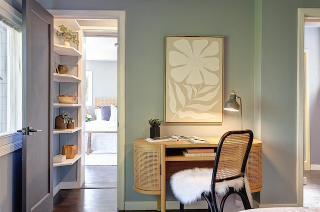 office area featuring baseboards and dark wood-style flooring