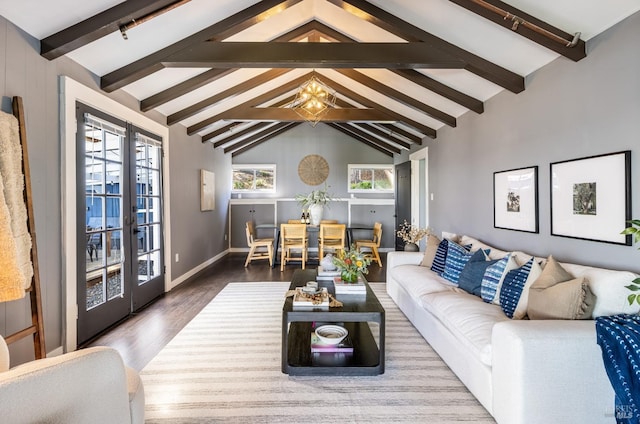 living area featuring french doors, lofted ceiling with beams, baseboards, and wood finished floors