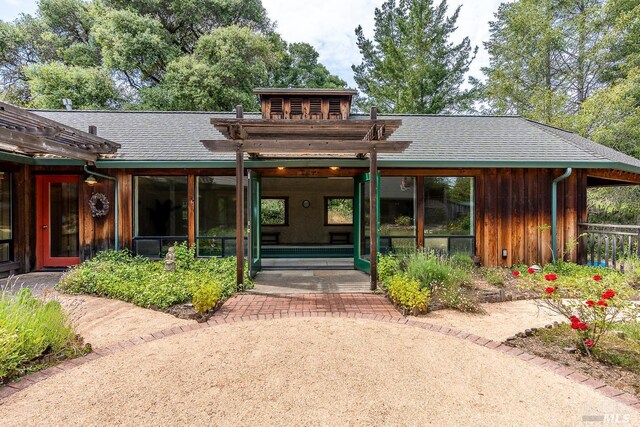 2151 Guntly Rd, Philo, CA 95466 - view of front of house with a pergola, a shingled roof, and board and batten siding