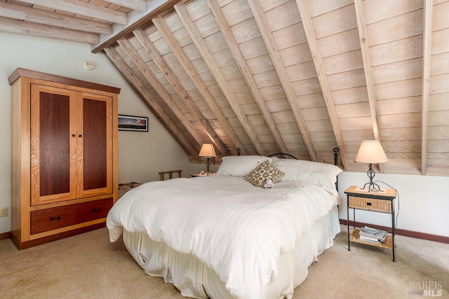 carpeted bedroom featuring vaulted ceiling with beams and wood ceiling