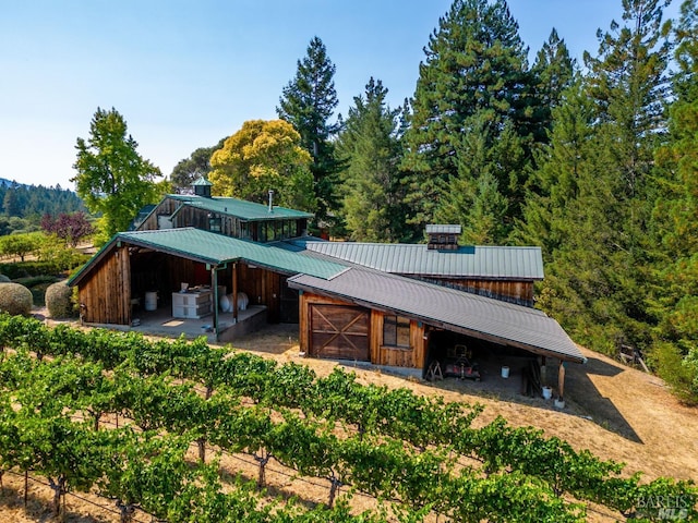 2151 Guntly Rd, Philo, CA 95466 - rear view of house featuring metal roof and a view of trees