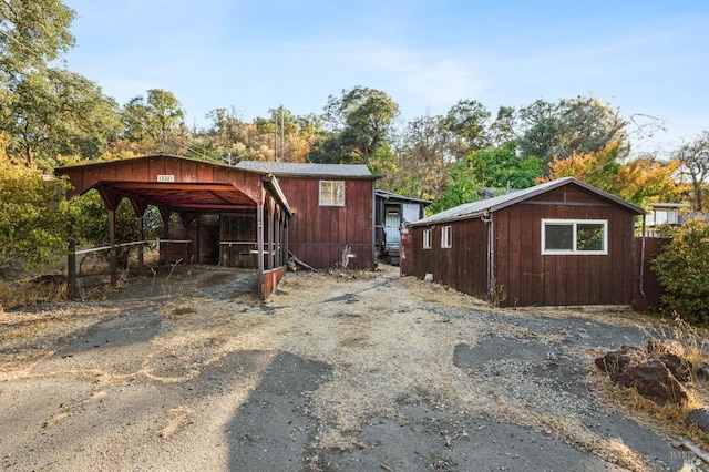 exterior space with a carport