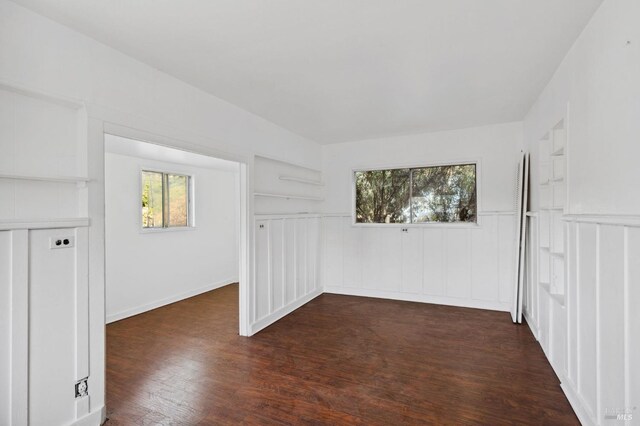 empty room featuring dark hardwood / wood-style flooring