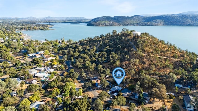 aerial view featuring a water and mountain view