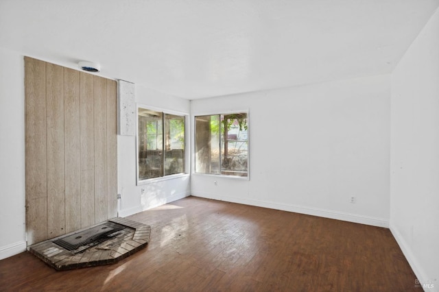 unfurnished living room with hardwood / wood-style flooring