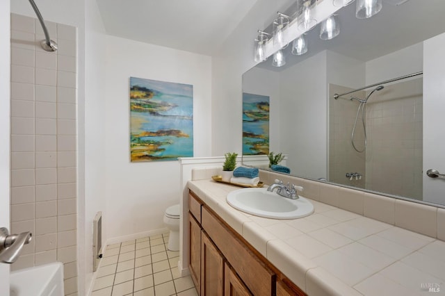 bathroom featuring tile patterned flooring, vanity, and toilet