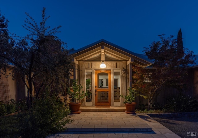 entrance to property featuring fence