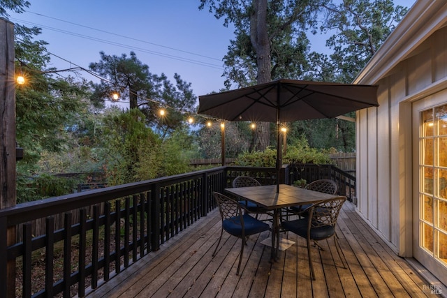 wooden deck featuring fence and outdoor dining area