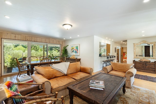 living area featuring wood finished floors and recessed lighting