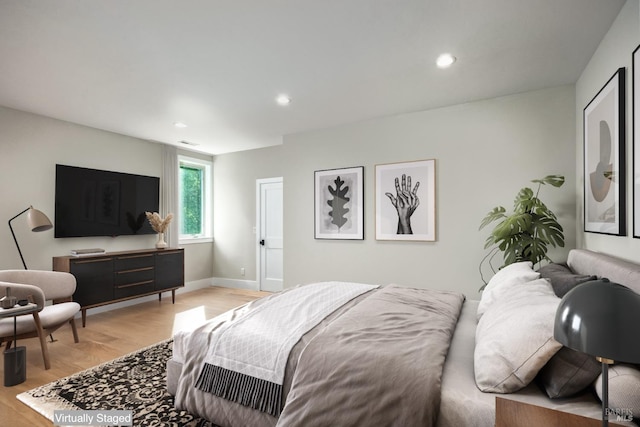 bedroom with light wood-type flooring