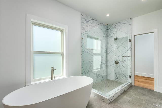 bathroom featuring separate shower and tub and tile patterned flooring