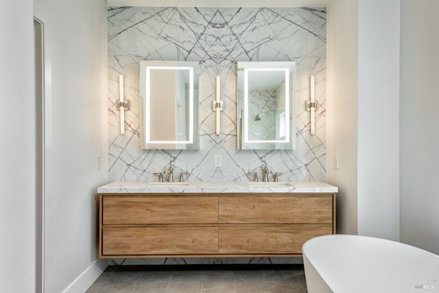 bathroom with vanity and a bath