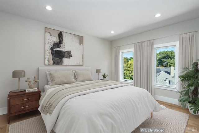 bedroom featuring hardwood / wood-style flooring