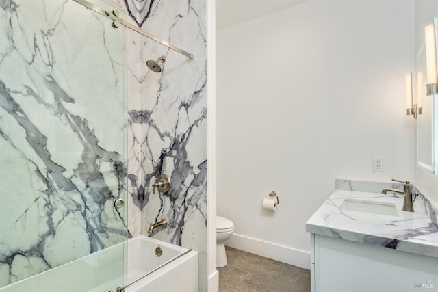 full bathroom featuring vanity, tiled shower / bath combo, and toilet