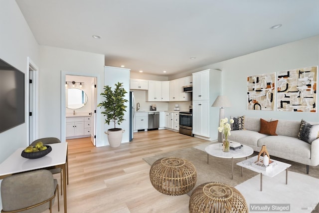 living room featuring light wood-type flooring