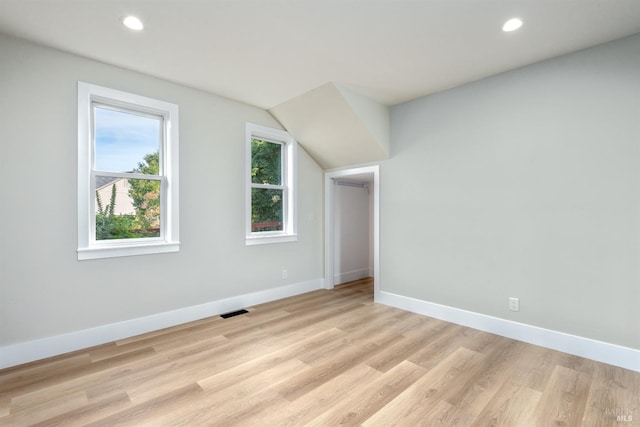 bonus room with light wood-type flooring