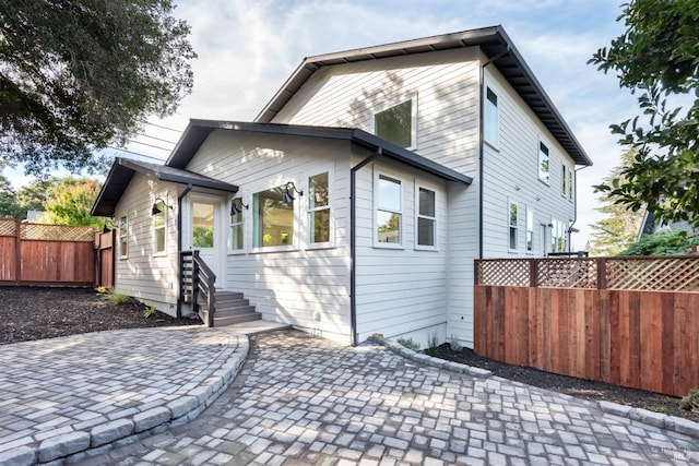 rear view of property with a patio area