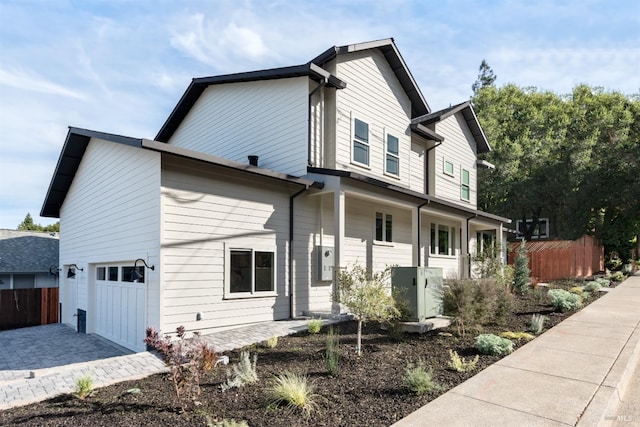 view of side of home with a garage