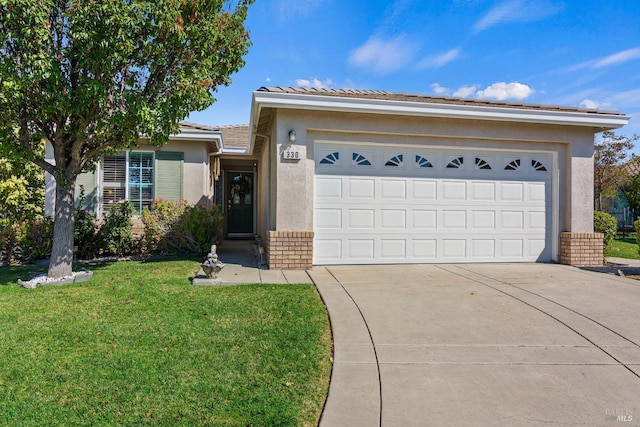 ranch-style house featuring a garage and a front yard