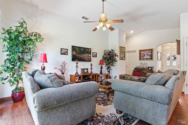 living room featuring light hardwood / wood-style floors, ceiling fan, and vaulted ceiling