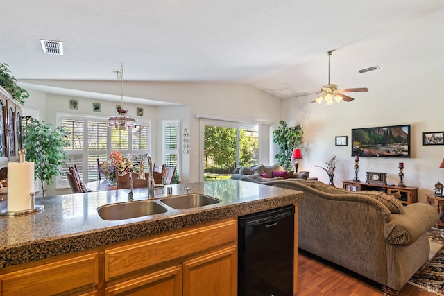 kitchen featuring lofted ceiling, wood-type flooring, black dishwasher, sink, and ceiling fan