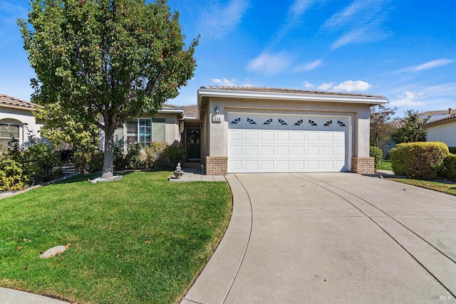 ranch-style home featuring a garage and a front lawn