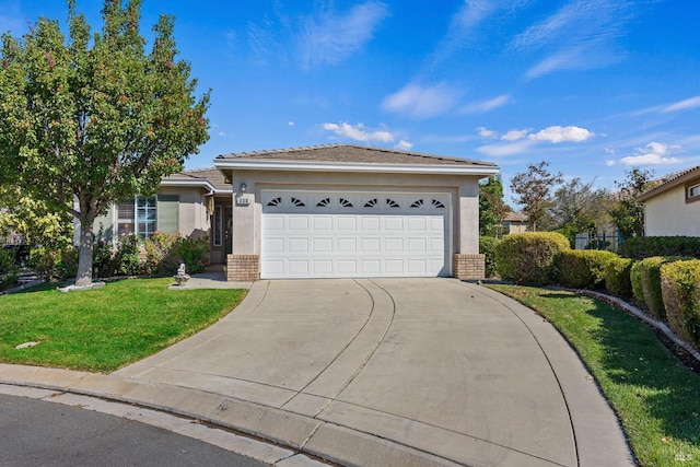 view of front facade featuring a garage and a front lawn