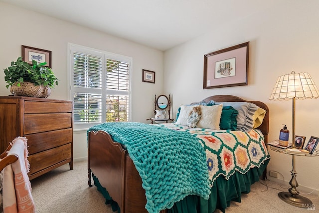 bedroom featuring light colored carpet