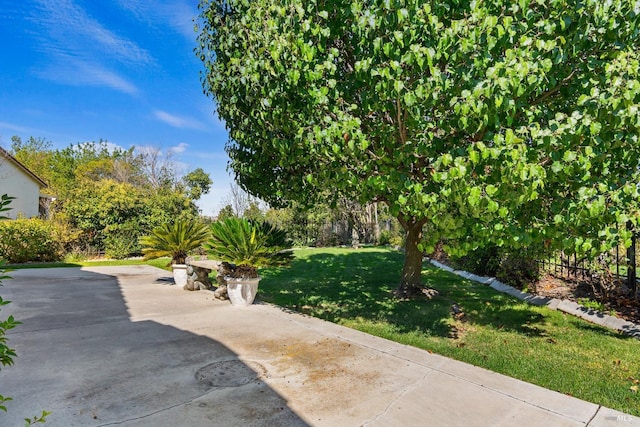 view of patio / terrace featuring fence