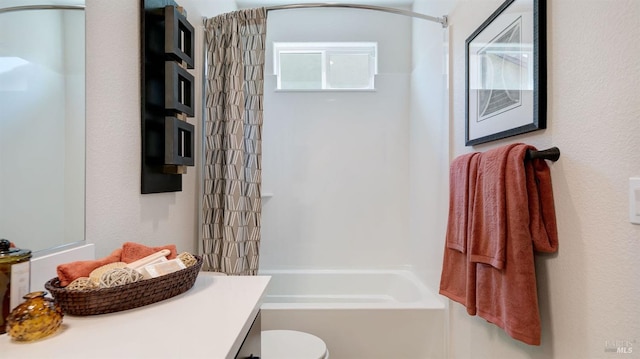 full bathroom featuring shower / tub combination, vanity, and toilet