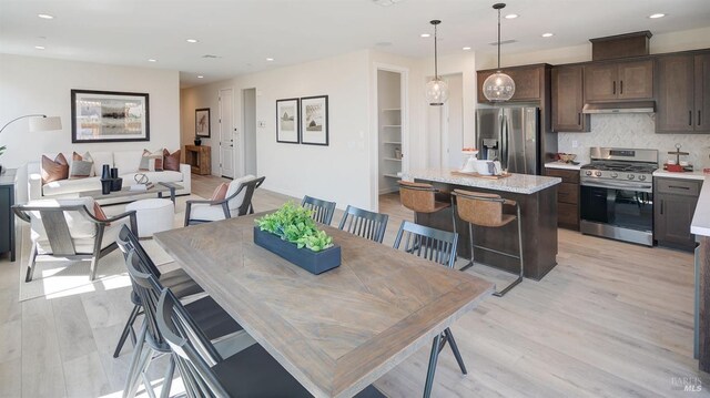 dining room with light wood-type flooring