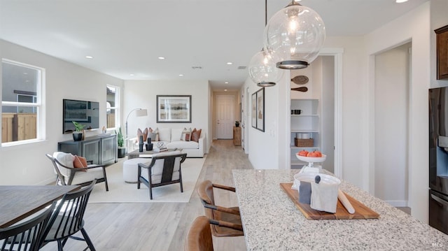 dining area featuring light wood-type flooring