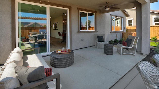 view of patio featuring ceiling fan