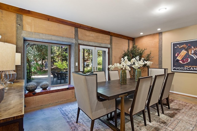 dining room featuring concrete flooring